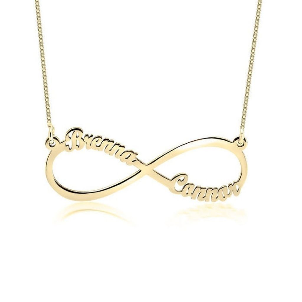 Gold infinity necklace with engraved names on a white background