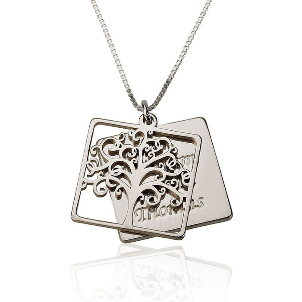 Silver necklace with a tree pendant on a white background