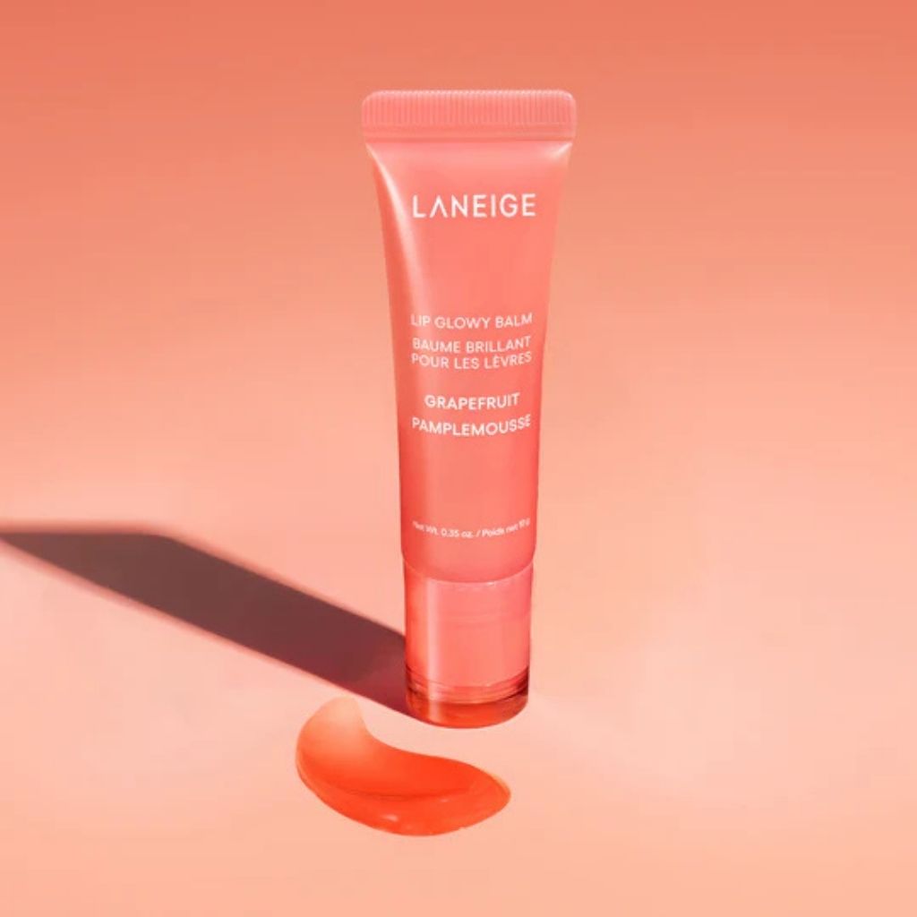 Laneige lip balm tube on a peach background