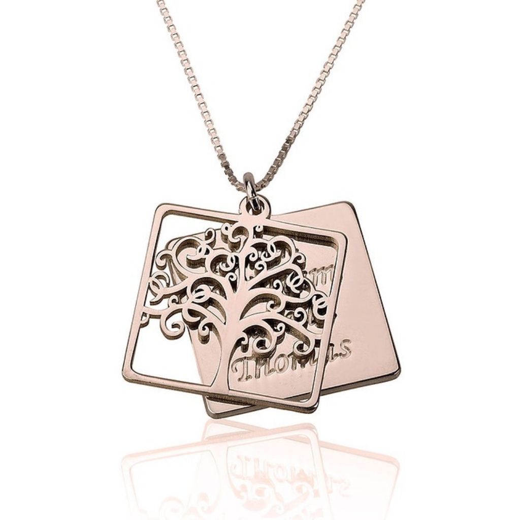 Rose gold necklace with tree pendant on a white background