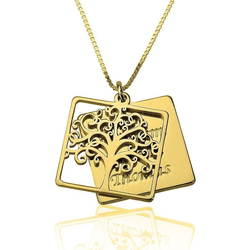 Gold necklace with a tree of life pendant on a white background