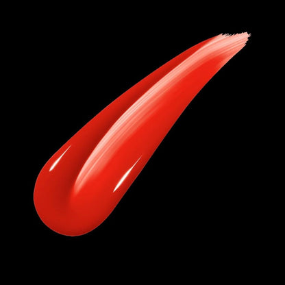 Red lipstick swatch on a black background