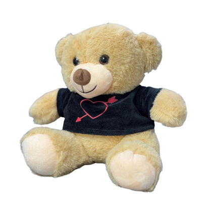 Plush teddy bear wearing a black shirt with a red heart design on a white background