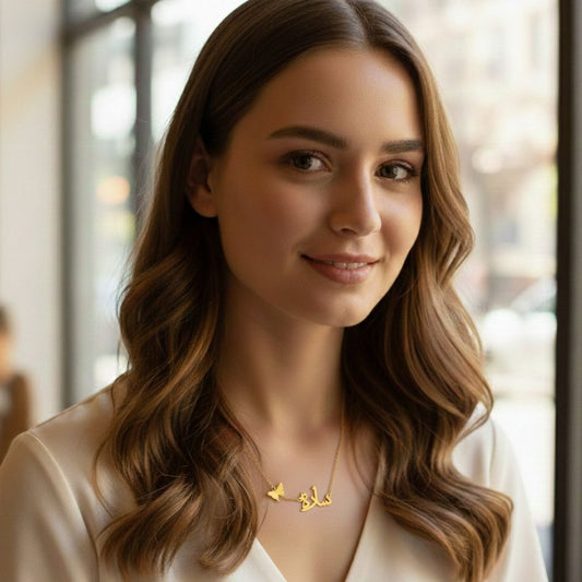 Woman wearing a gold necklace with a blurred background