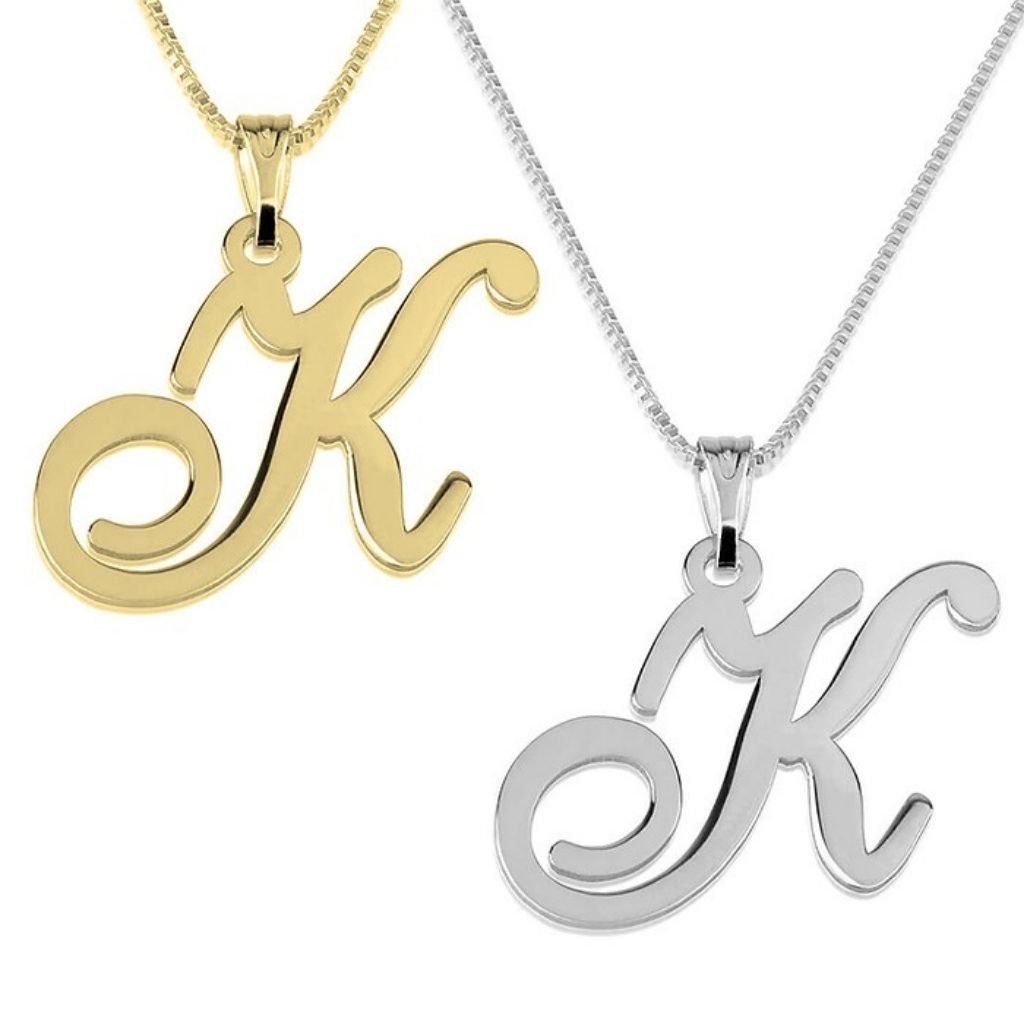 Gold and silver 'K' letter pendants on white background
