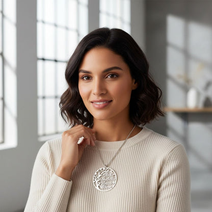 Woman wearing a necklace with a pendant in a bright room
