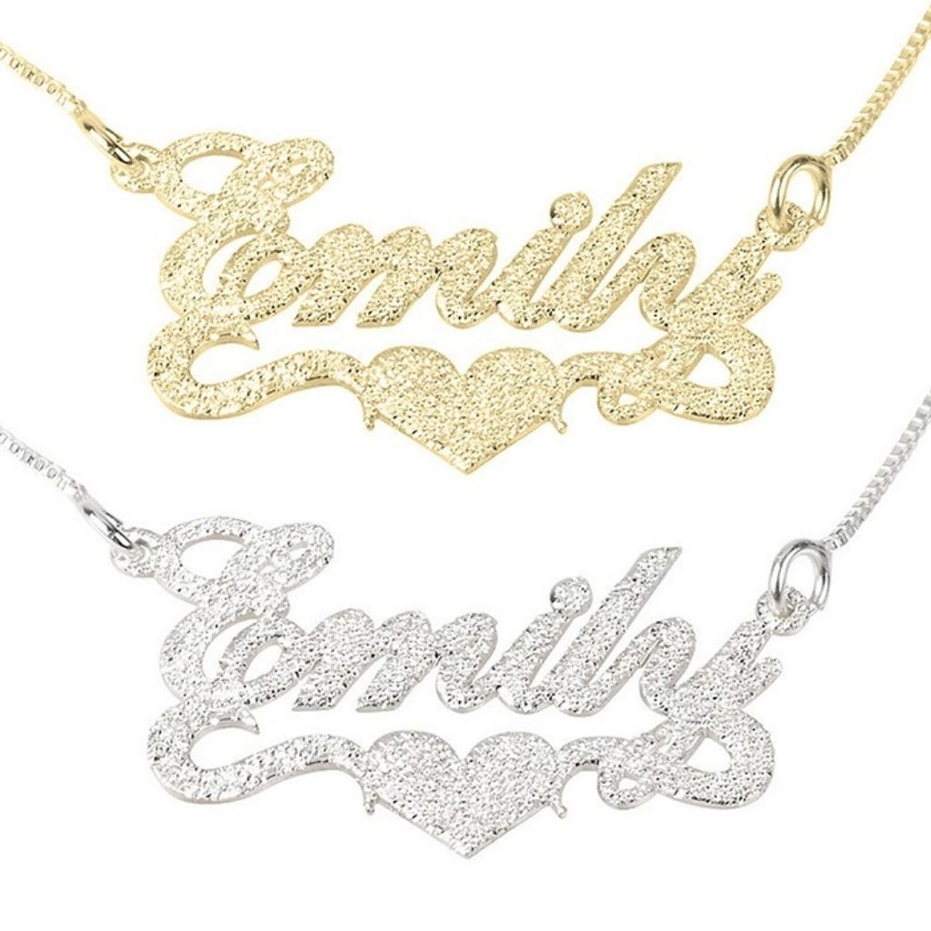 Gold and silver 'Emily' nameplate necklaces on a white background