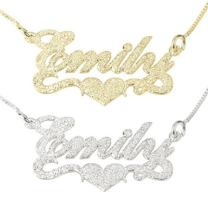 Gold and silver 'Emily' nameplate necklaces on a white background