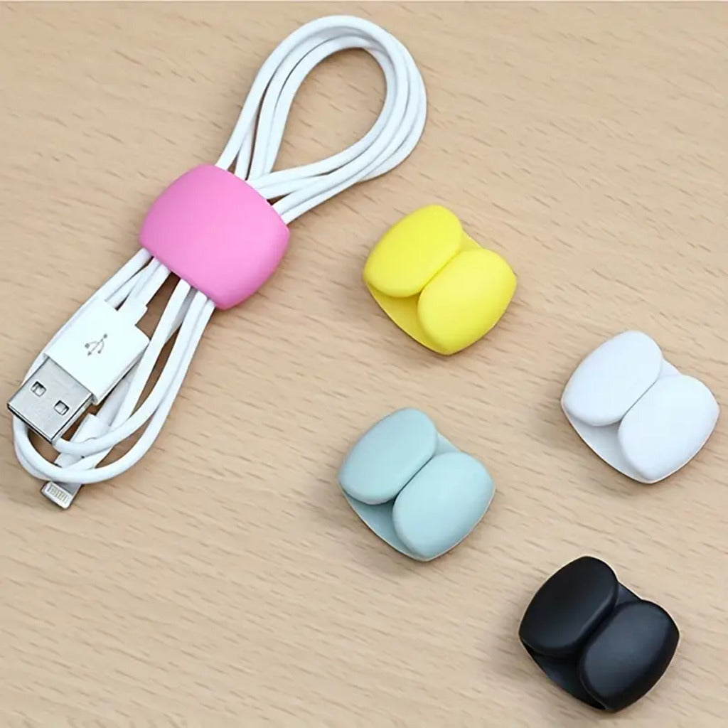 White USB cable with colorful cable protectors on a wooden surface