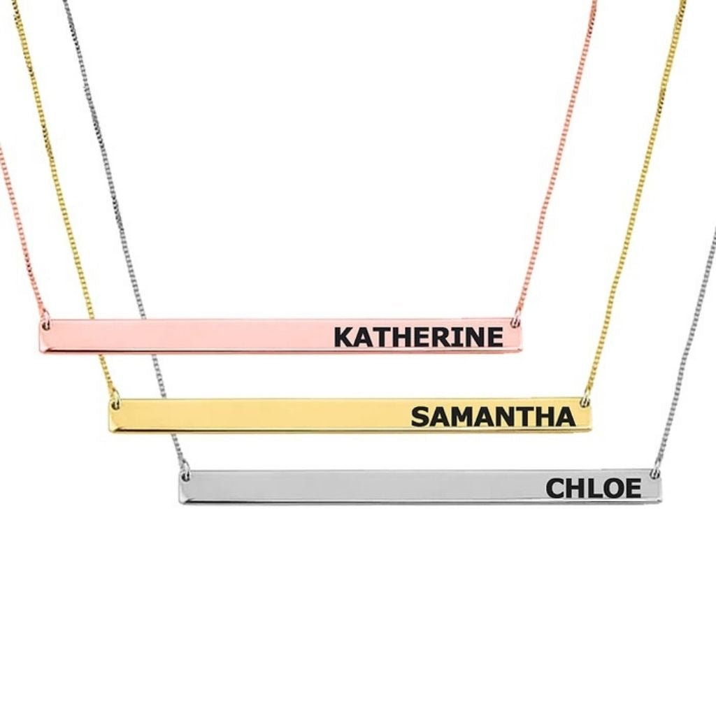 Three name bar necklaces in different colors on a white background