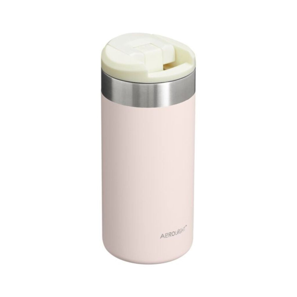 Pink thermos with silver base and white lid on a white background