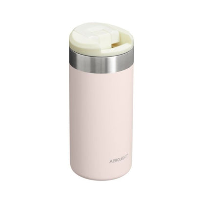 Pink thermos with silver base and white lid on a white background