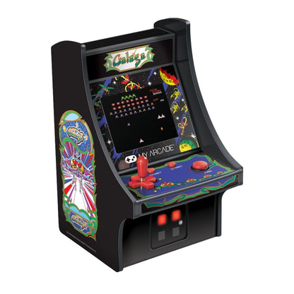 Miniature arcade machine with colorful graphics on a white background