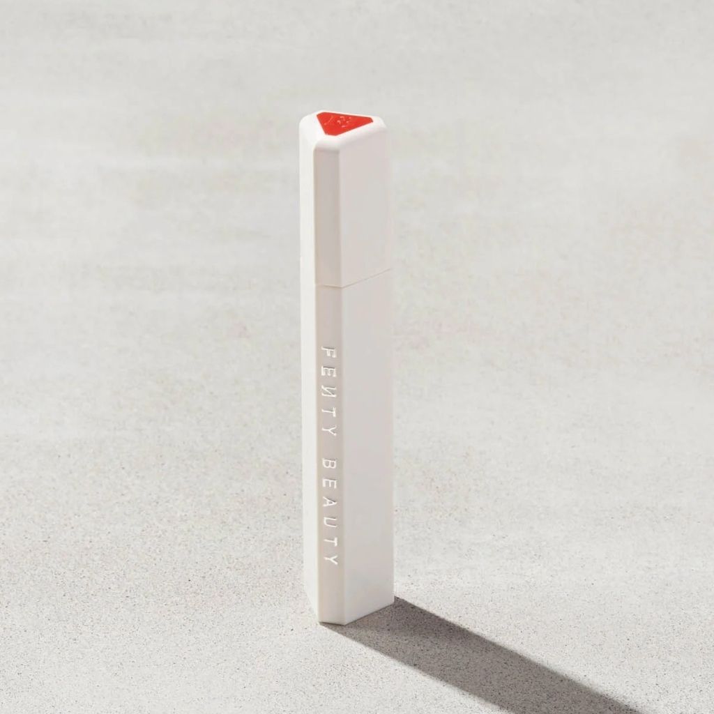 Fenty Beauty product on a textured gray background