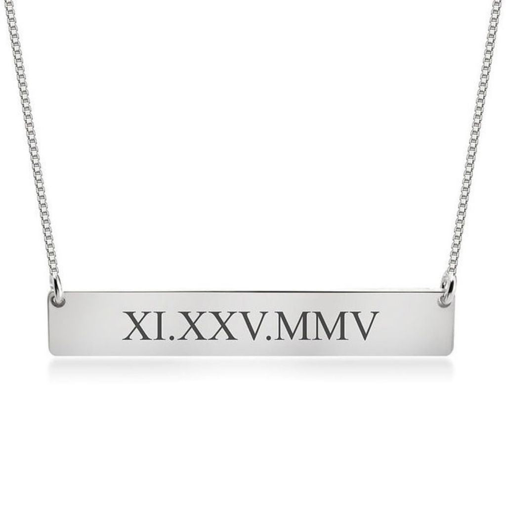 Silver bar necklace with Roman numeral engraving on a white background