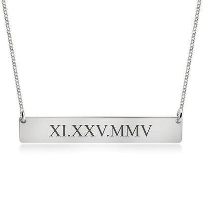 Silver bar necklace with Roman numeral engraving on a white background