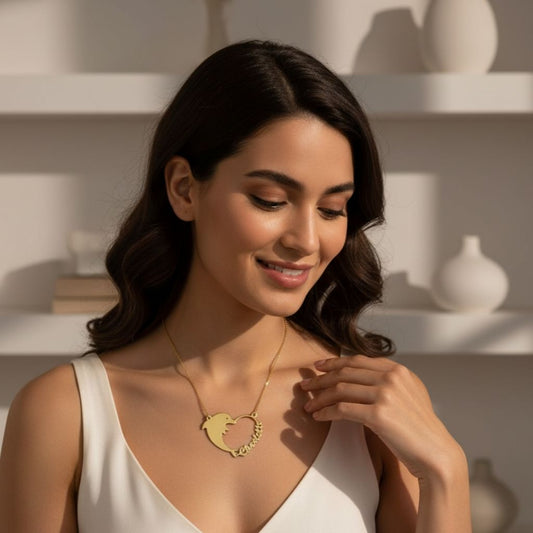 Woman wearing a gold necklace in a softly lit room