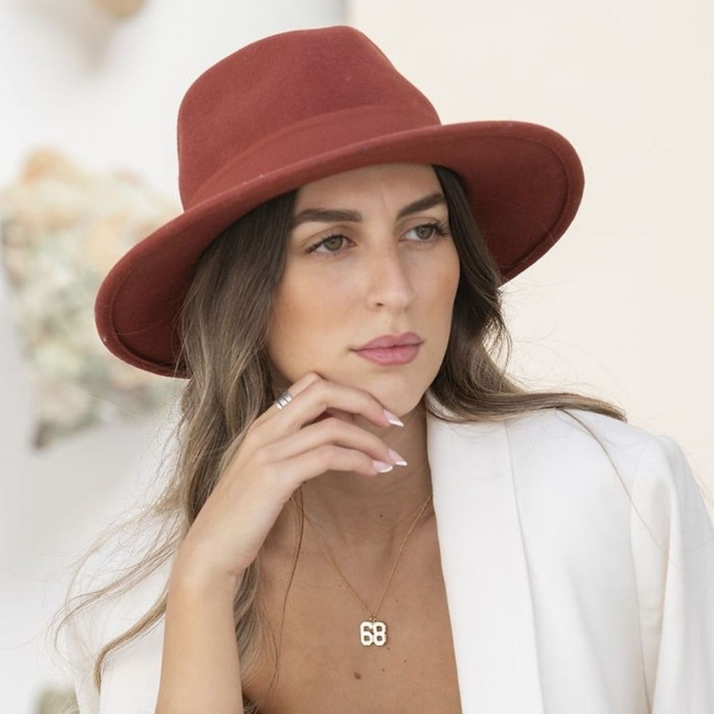 Woman wearing a red hat with a blurred background