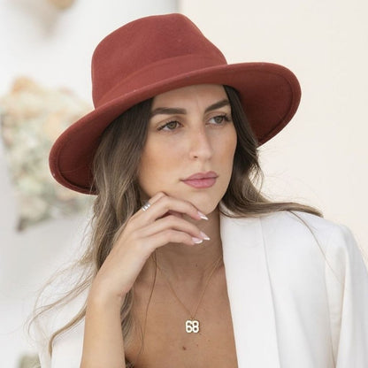 Woman wearing a red hat with a blurred background