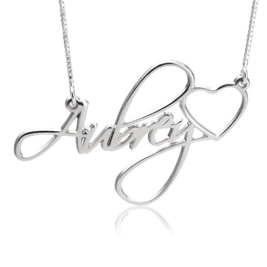 Silver necklace with 'Aimee' and heart design on a white background