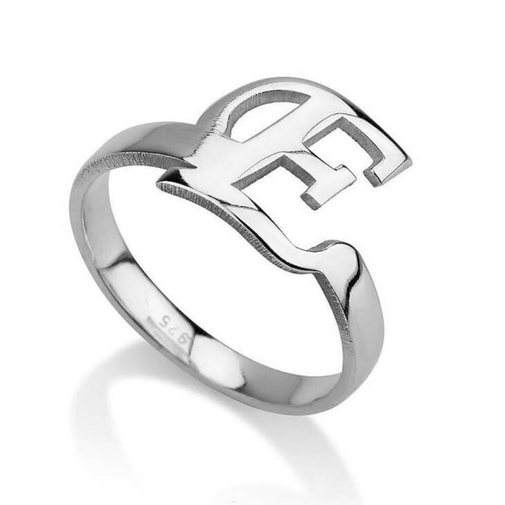 Silver ring with a unique design on a white background