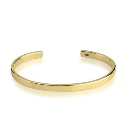 Gold bracelet on a white background