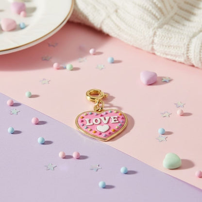 Heart-shaped charm with 'LOVE' text on a colorful background