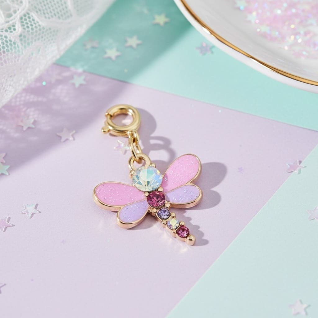 Colorful dragonfly charm with gemstones on a pastel background