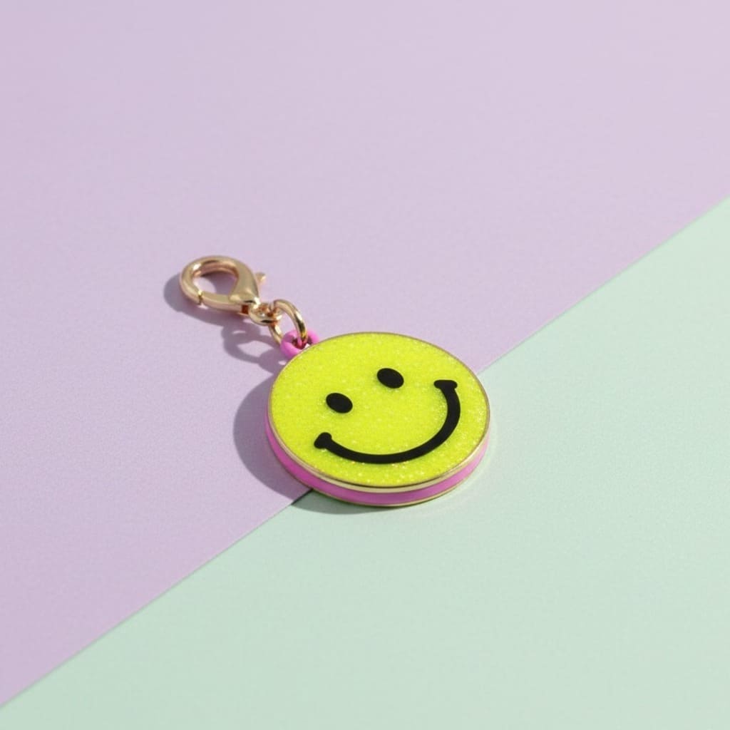 Smiley face charm on a pastel background