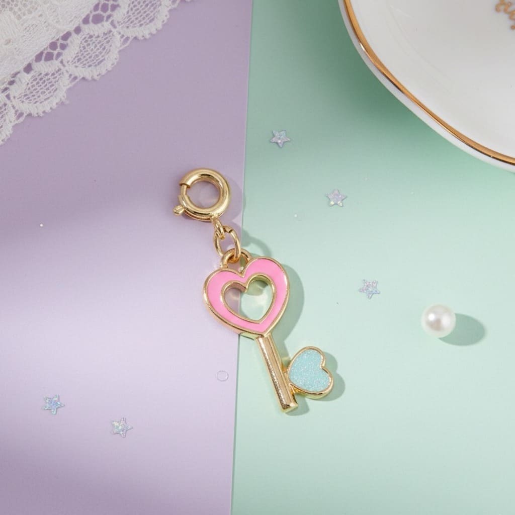 Pink heart-shaped key charm on a pastel background