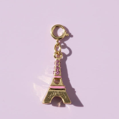 Eiffel Tower charm with pink accents on a light purple background