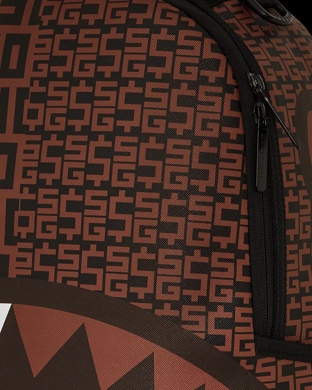 Close-up of a backpack with a geometric pattern on a brown background