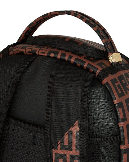 Black backpack with brown patterned straps on a black background