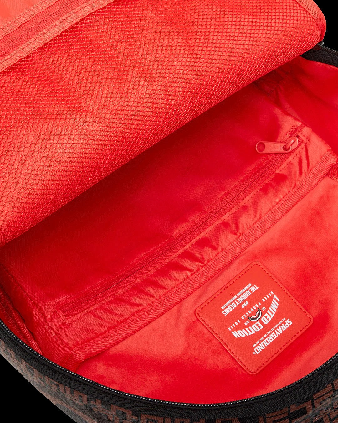 Red backpack with a visible brand logo on a white background