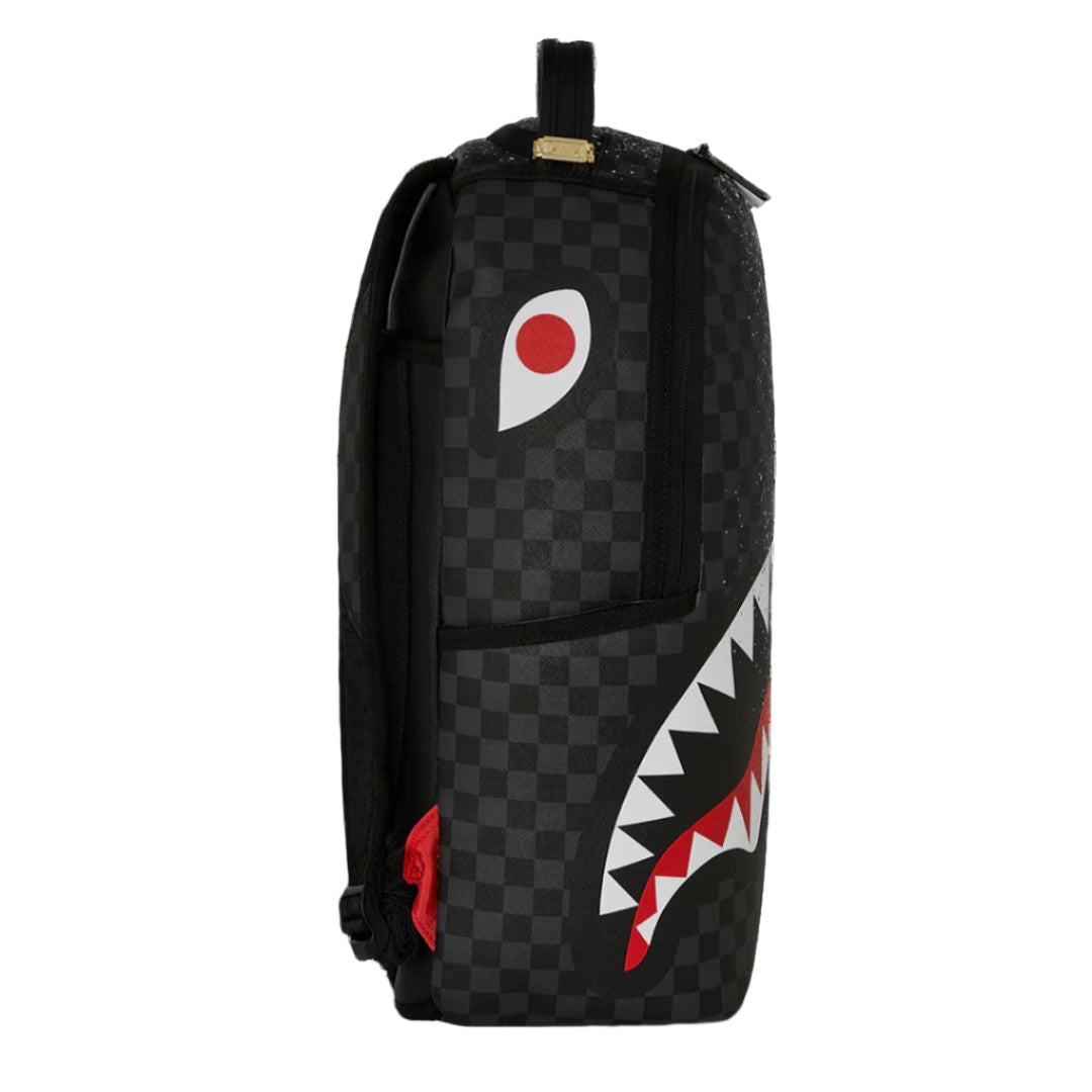 Backpack with checkered pattern and shark mouth logo on a black background