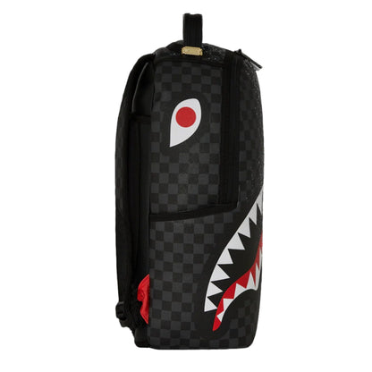 Backpack with checkered pattern and shark mouth logo on a black background