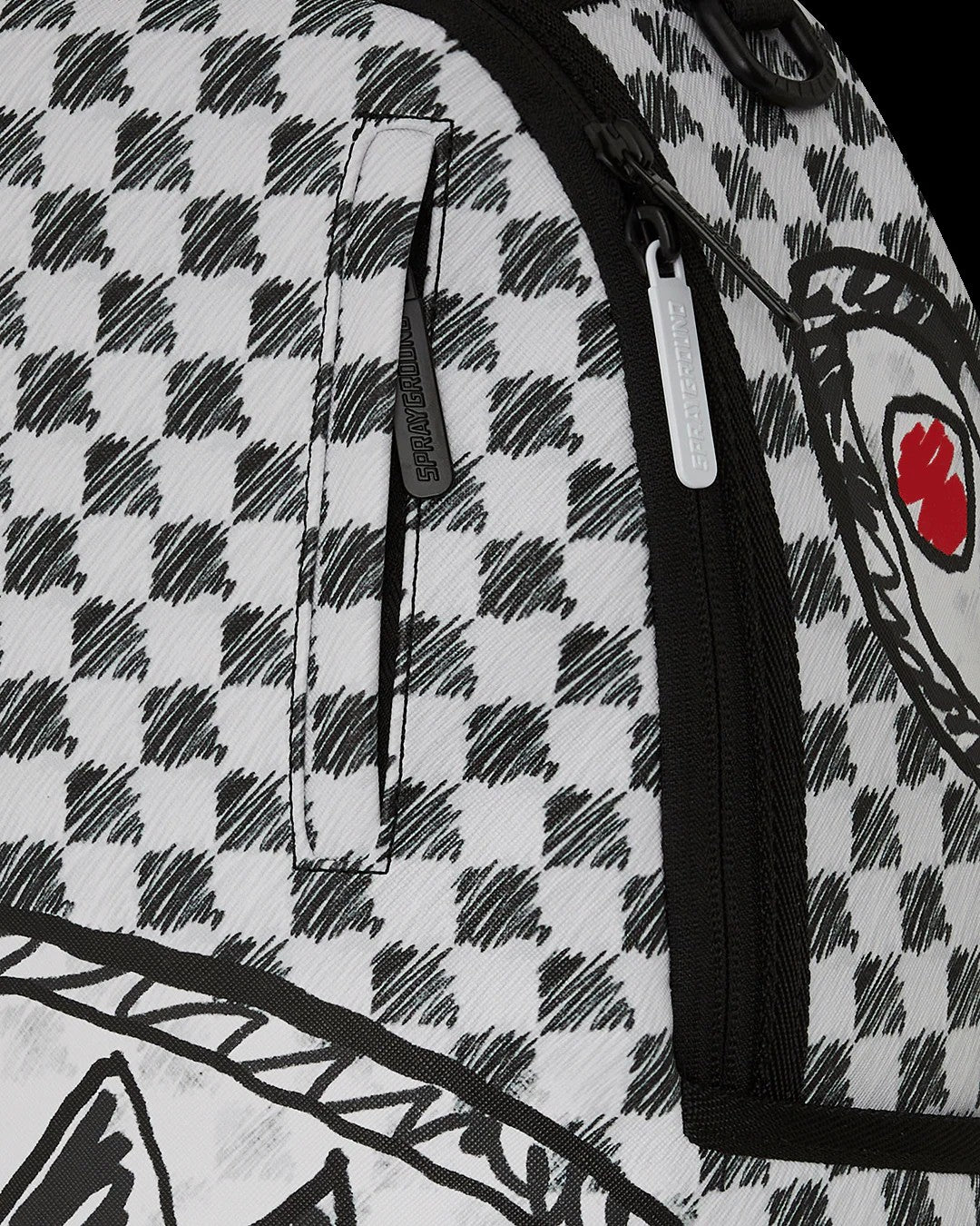 Close-up of a backpack with a checkered pattern and a brand logo.