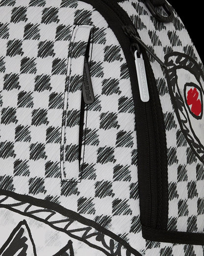 Close-up of a backpack with a checkered pattern and a brand logo.