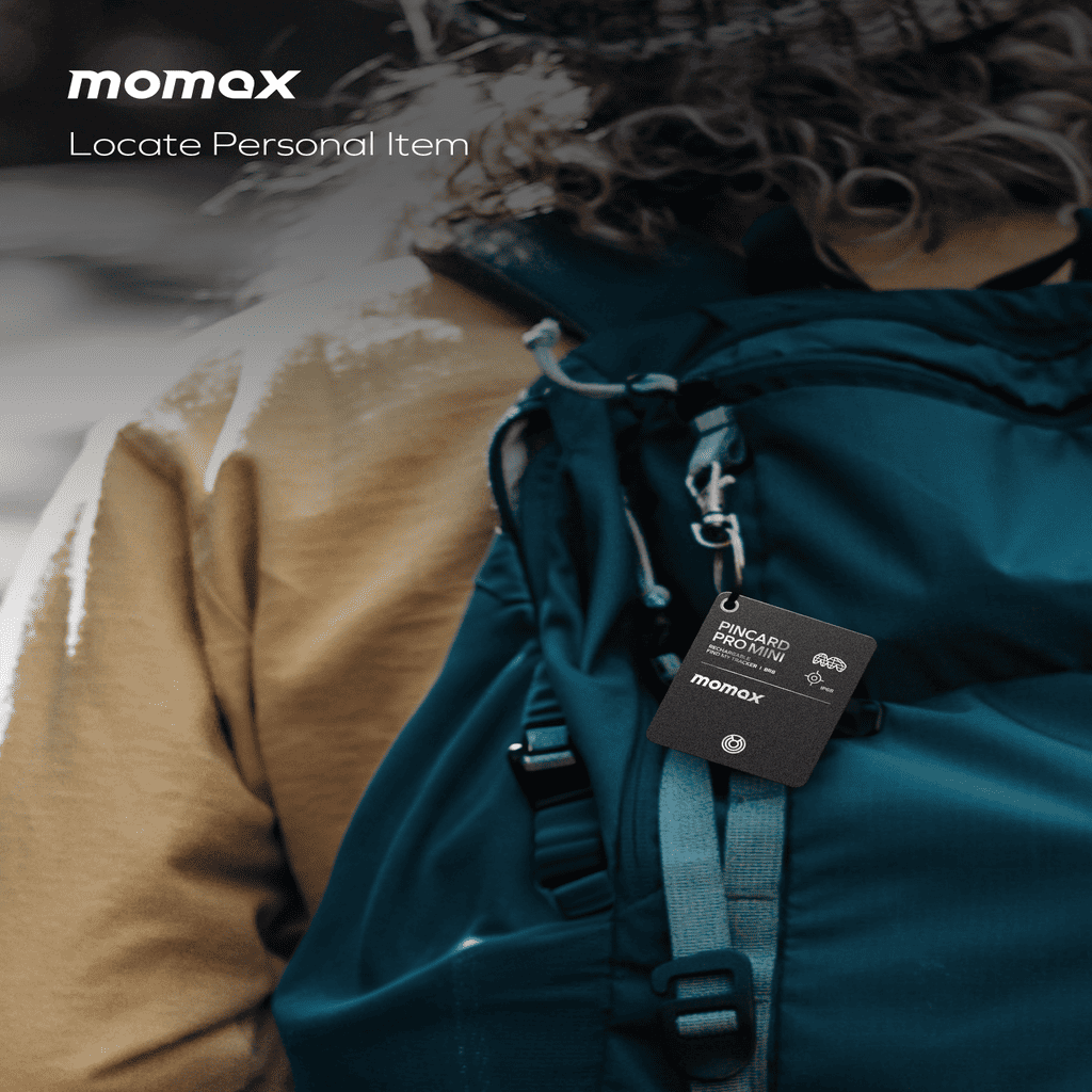 Person wearing a teal backpack with a Momax tag, focusing on locating personal items.