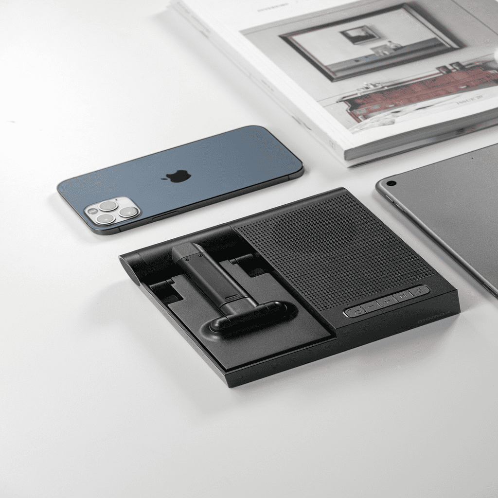 Black phone stand with smartphone and tablet on a white surface