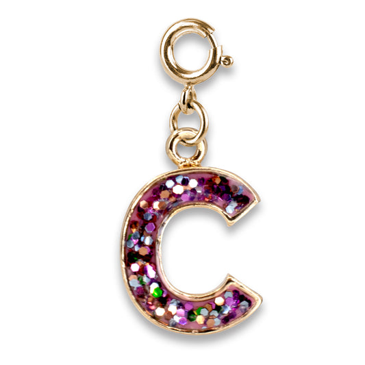 Gold charm with a pink, glittery letter 'C' on a white background