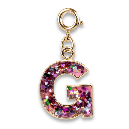 Gold charm with a glittery letter 'G' on a white background