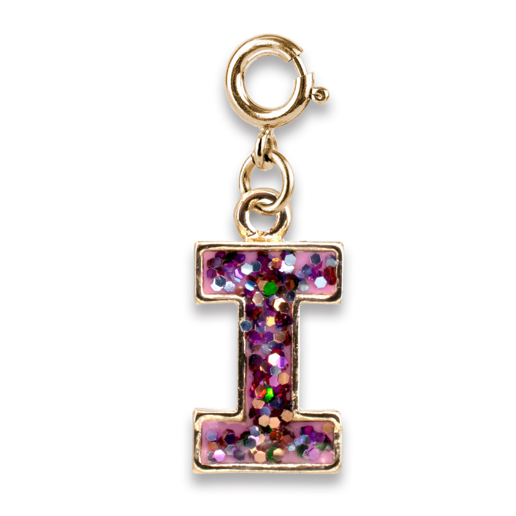 Gold charm with a pink glittery letter 'I' on a white background
