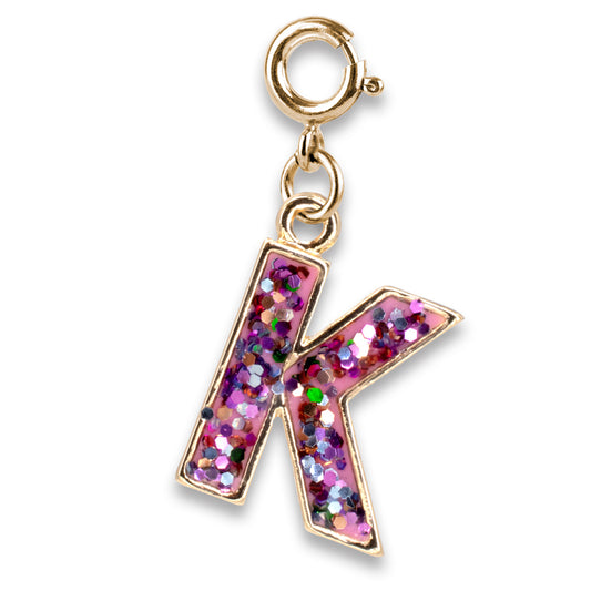 Gold charm with a pink glittery letter 'K' on a white background