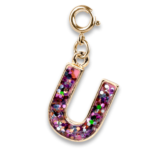 Gold charm with a colorful glittery horseshoe design on a white background