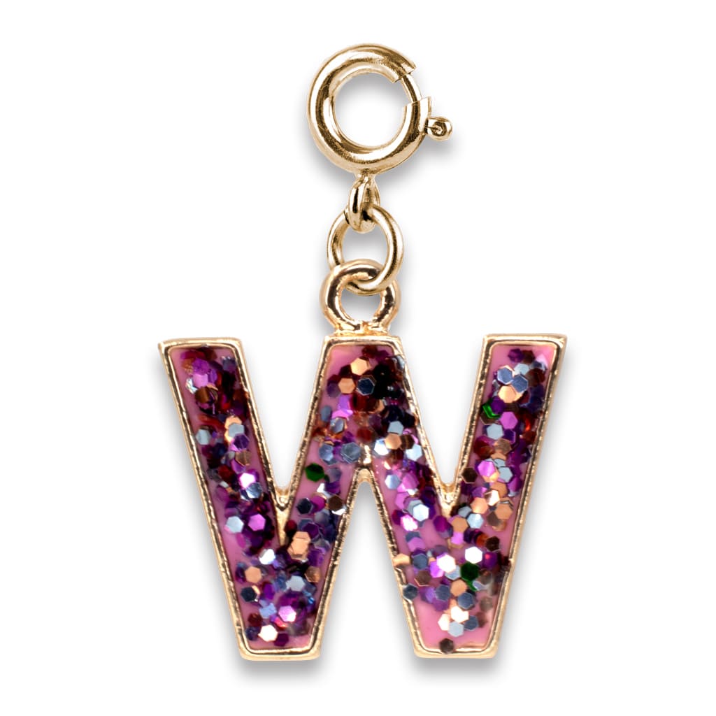 Gold charm with a pink, glittery cross on a white background