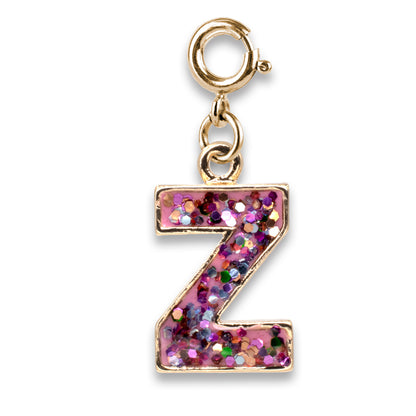 Gold charm with a pink glittery letter 'Z' on a white background