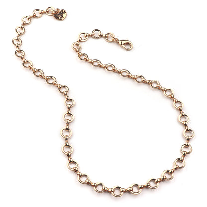 Gold chain necklace on a white background