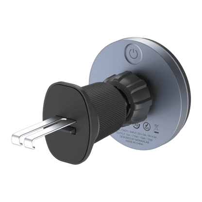 Plumbing fixture with black handle and silver lever on a green background