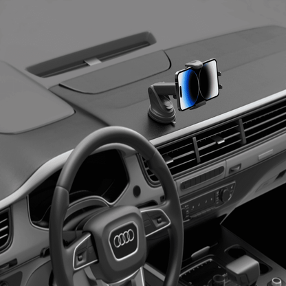 Car dashboard with a smartphone holder and steering wheel of an Audi car.